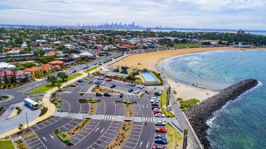 Aerial view of Williamstown beach and foreshore with Melbourne city skyline in the distance